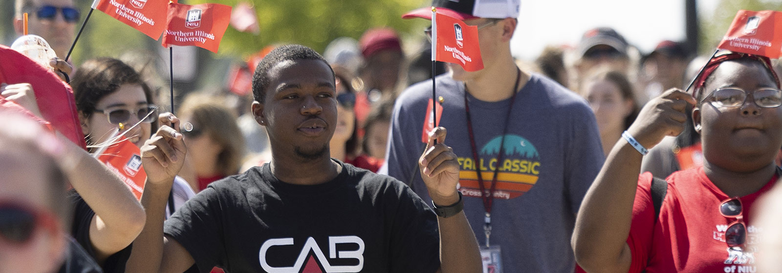 Four smiling students at involvement fair